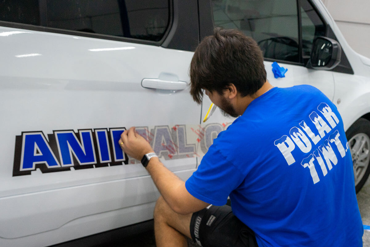 Custom cut-vinyl door decals and lettering applied to a commercial service vehicle in southwest Las Vegas
