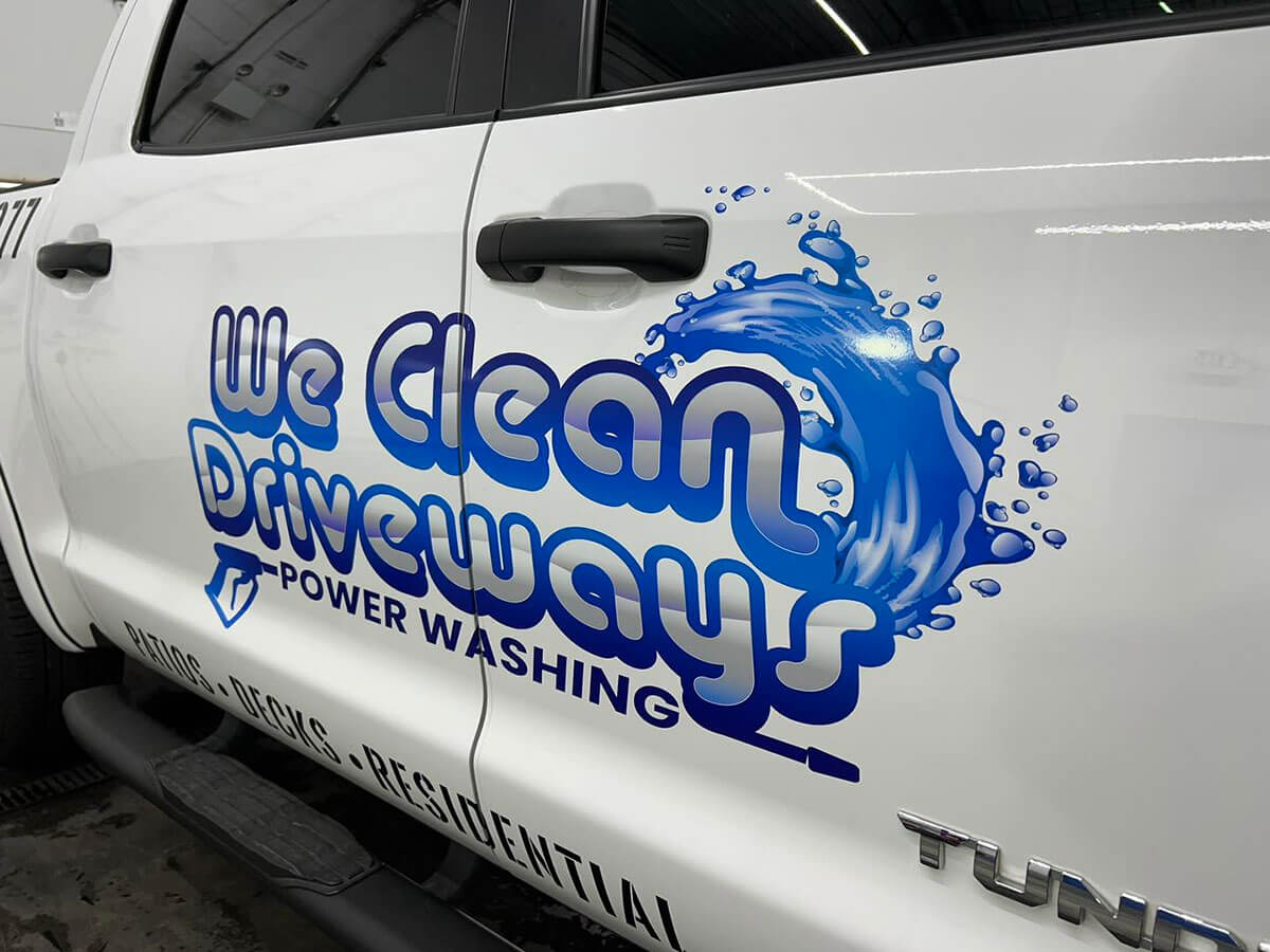 Storefront window vinyl graphics and large-format printed signage on a commercial building in southwest Las Vegas